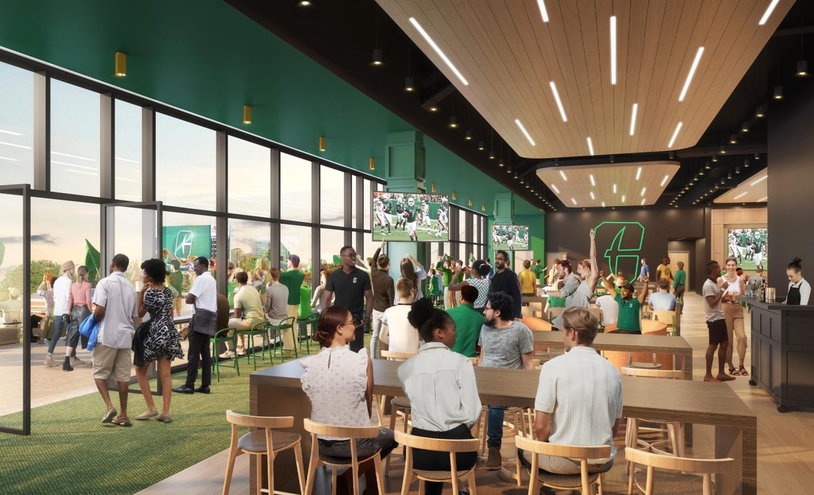 People sitting inside new area in the football stadium